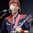 Peter Abbott with a guitar